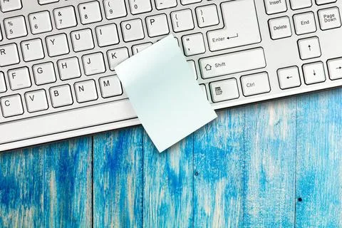 Sticky note is on the computer keyboard Sticky note is on the keyboard of ... Stock Photos