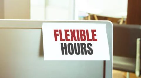 Sticky note on the computer. Text FLEXIBLE HOURS Stock Photos