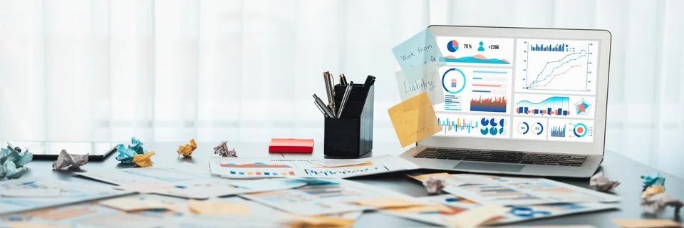 Sticky note for creative and analytic brainstorm with BI data on laptop. Prodigy Stock Photos