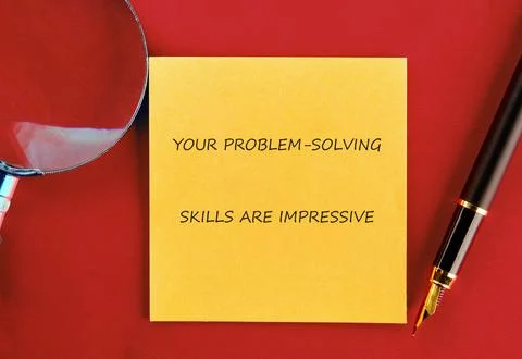 A sticky note with an encouraging message about problem-solving skills is p.. Stock Photos