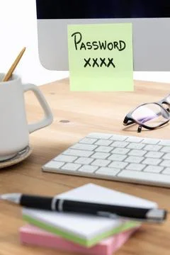 Sticky Note with Password on Computer Screen Highlighting Security Risks Stock Photos