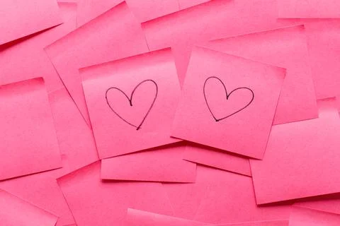 Sticky note post it in pink color as background Photos