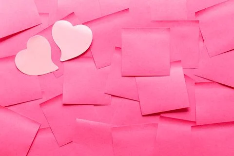 Sticky note post it in pink color as background Photos