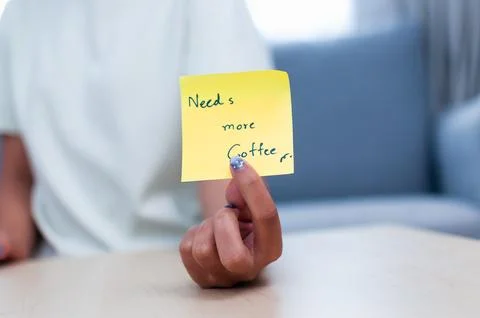 Sticky note reading needs more coffee Stock Photos