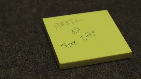 Sticky Note Reminder for April 15 Tax Day Stock Footage 333493500