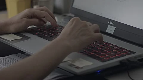 Sticky note reminders, Qwerty keyboard typing, slow motion scenery Stock Footage 292764026
