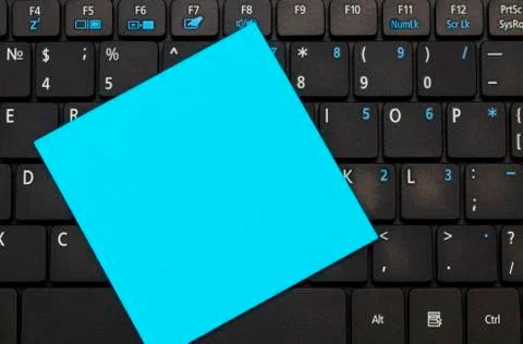 Sticky note with space for your text on the keyboard Stock Photos
