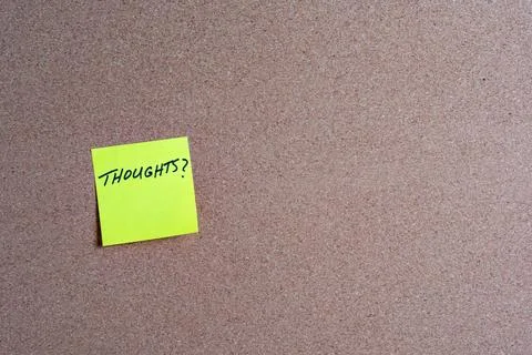 Sticky Note with Thoughts on a Corkboard Stock Photos