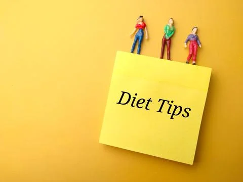 Sticky note with the word Diet tips. Stock Photos