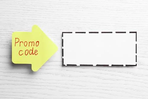 Sticky note with words Promo Code and blank card on white wooden table, flat  Stock Photos
