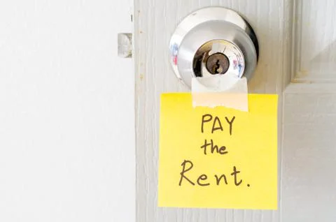 Sticky note write a message pay the rent Stock Photos