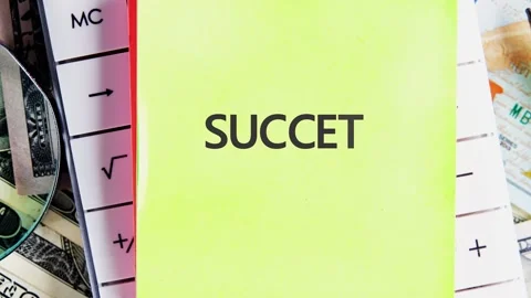 Sticky notes display the words such and success alongside piles of money. The Stock Footage 339293184