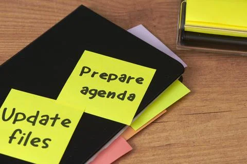Sticky notes on a notebook for daily task planning Stock Photos