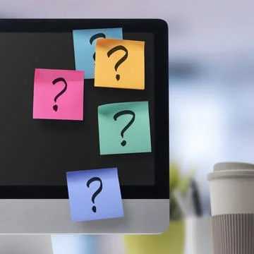 Sticky notes with question marks on computer screen 스톡 사진