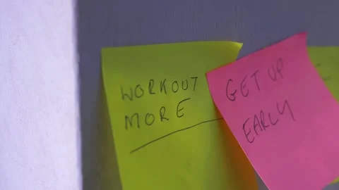 Sticky notes on a wall to make positive changes Stock Footage 163922317