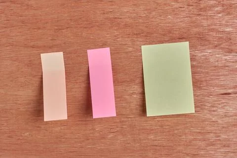 Sticky notes on wooden surface Stock Photos