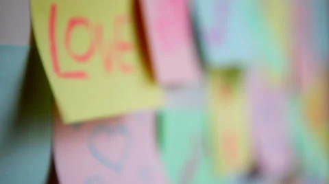Sticky paper adhesive note on wall, with marriage or relationship, love concept Stock Footage 57702468
