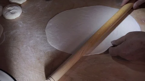 Stiff dough rolled thinly Stock Footage 106198436