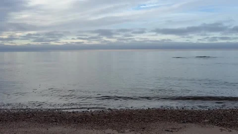Still Baltic Sea Water with Distant Horizon and Soft Light in 4K with Sound Stock Footage 323010180