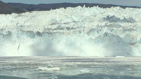 Still of  clouds moving on a 15-meters high glacier front arctic Greenland Stock Footage 59999328