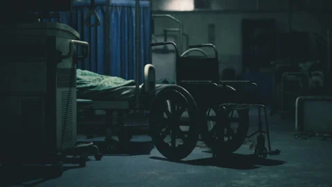 Still hospital scene featuring unoccupied wheelchair and tense lighting scene Stock Footage 330115989