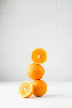 Still life balance of oranges on a white background. Copy space. 스톡 사진