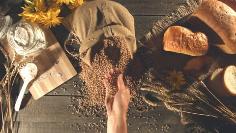 Still life with bread, wheat, flour and flowers. Stockbeeldmateriaal 89140670
