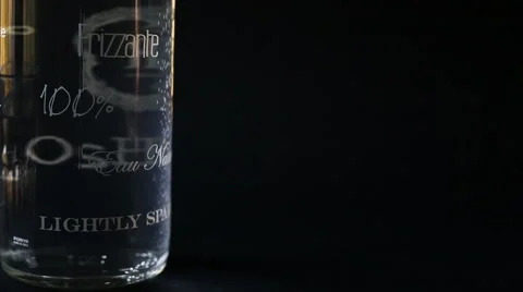 A still life bubbles of a bottle sparkling water in a blue dark background Stock-Footage 56376516