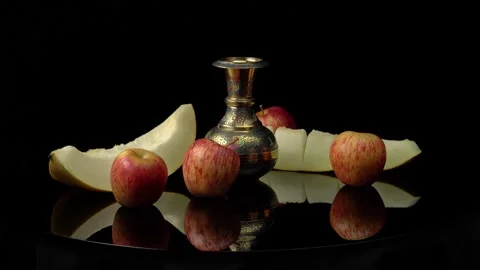 Still life with cut melon and apples on a black background 库存影片 159535238