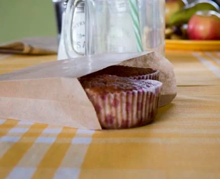 Still life with fresh muffins on the table in yellow tones Stock Photos