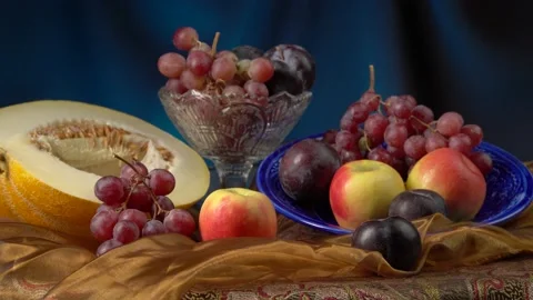 Still life with melon and fruit on a dark blue background. Video stock 160193089