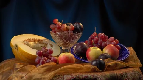 Still life with melon and fruit on a dark blue background. Stock Footage 160323490