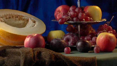 Still life with melon and fruit on a dark blue background. Stock Footage 160323577