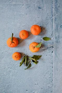 Still Life oranges composition in a blue stone background Stock Photos