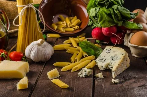 Still life photo, background with pasta and cheese Stock Photos