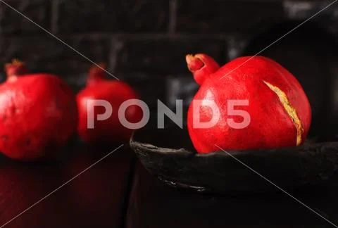 Still life with a pomegranate. Autumn fruits. Stock Photos