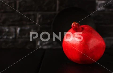 Still life with a pomegranate. Autumn fruits. Stock Photos