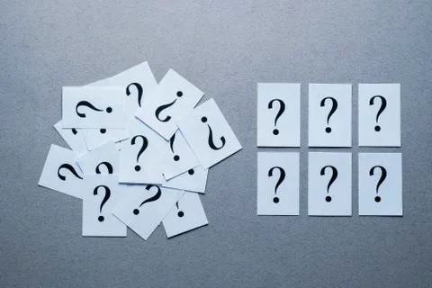 Still life of printed question mark on white paper Stock Photos