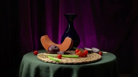 Still life with pumpkin, cherry tomatoes, red onions and green onions Video stock 146889784