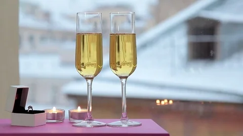 Still life with a ring in a box with glasses of champagne Video stock 69222857