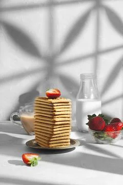 Still life with a stack of cookies on a gray table with strawberries 写真素材