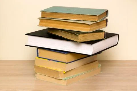 Still life with a stack of old books on a table Stockfoto's