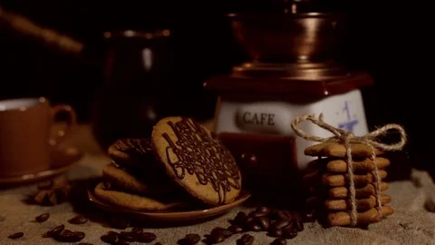 Still life. On the table there are a coffee mill, cookies, cups. Stock Footage 82296199