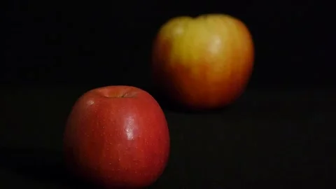Still life of two red apples isolated on a black background. Close up Stock Footage 106204739