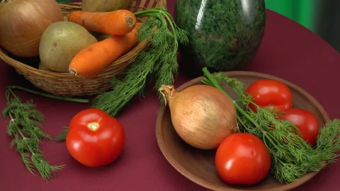 Still life with vegetables on a green background. Vídeos de archivo 147656098