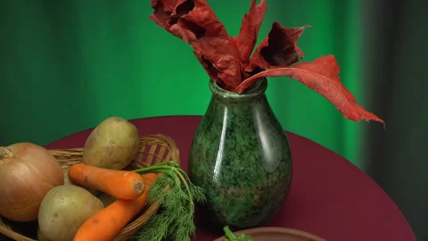 Still life with vegetables on a green background. Stock Footage 148322323