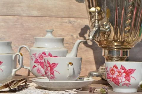 Still samovar tea donut on the table with white painted cups Stock Photos