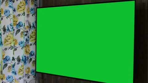 Still shot of a large television fixed on a wooden wall, green chroma key on tv Stock Footage 147408388