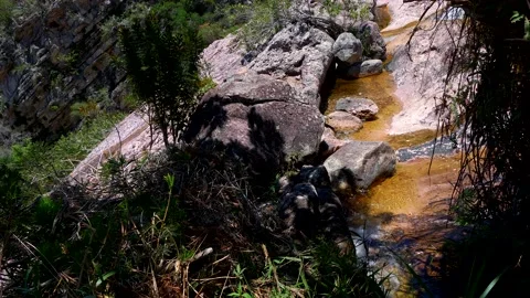 Still shot of a stream flowing along a mountainside, Vale do Capao, Bahia Brazil Stock Footage 237477662