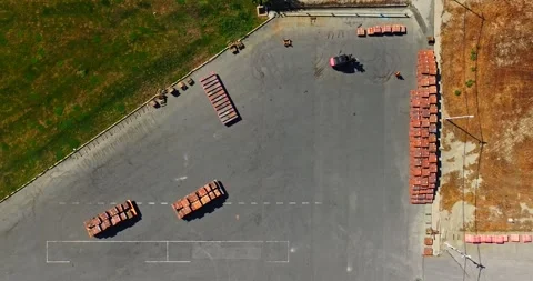 Still Shot Timelapse Of Forklift Operator Preparing Pallets For Moving On Sunny Video stock 300445472
